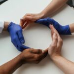 Circle shaped gesture. Group of doctors are holding hands in trust together