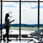 silhouette-of-woman-in-an-airport-lounge-waiting-f-2023-11-27-05-20-48-utc (1)