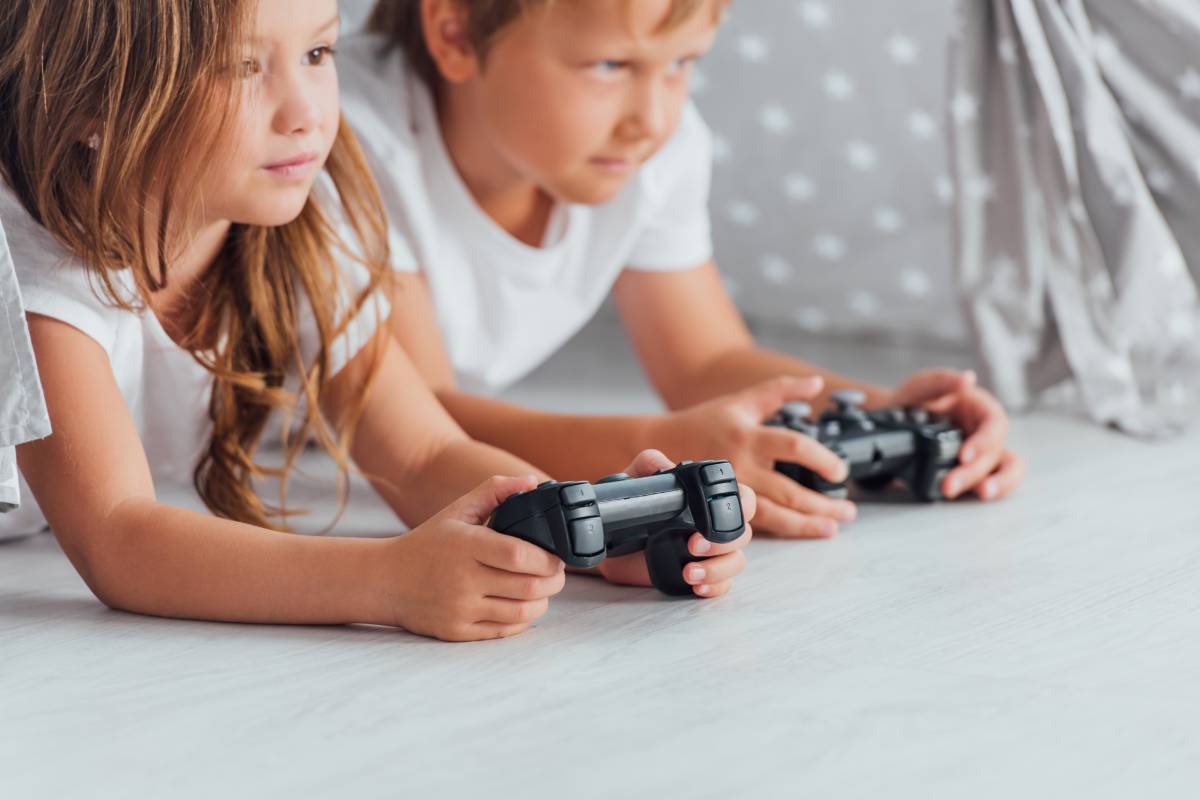 Children’s with playing a game with sister